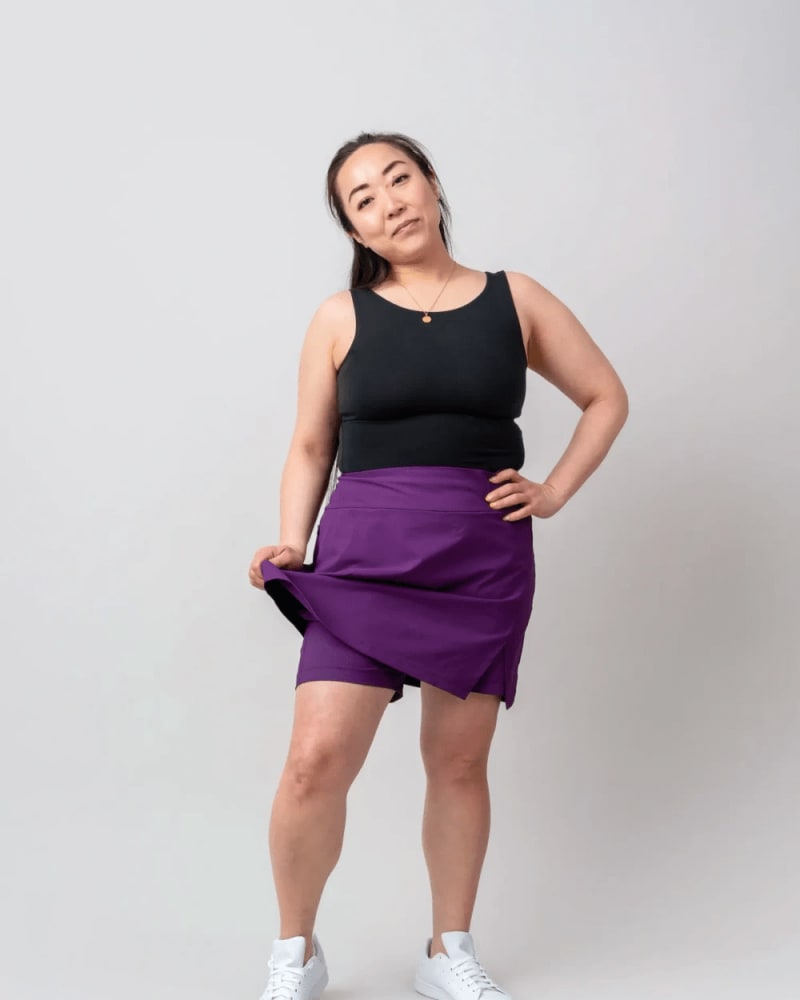 Front of a model wearing a size XL get dirty skort in Eggplant by alder apparel. | dia_product_style_image_id:300722